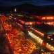 A screenshot from the anime shows Yoshiwara at night, with glowing lanterns.
